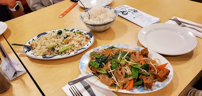 Family-style tofu and fried rice on the table